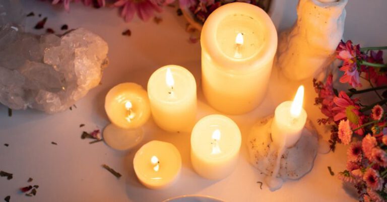 Bohemian Crystal - Candles, a mortar and a bowl of flowers