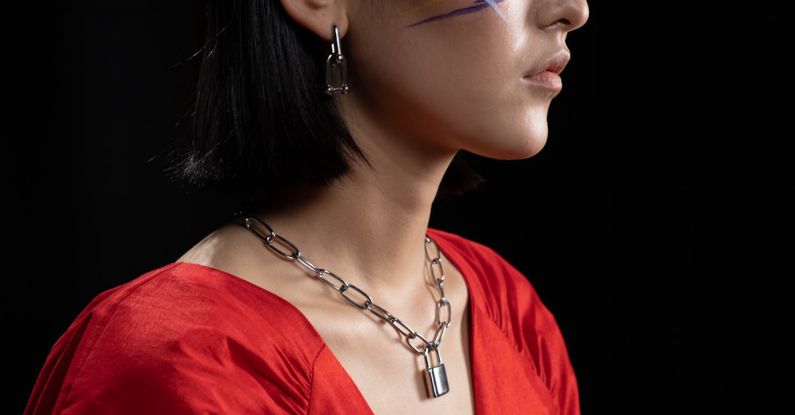 Jewelry - Woman with Face Paint Wearing a Silver Chain Necklace