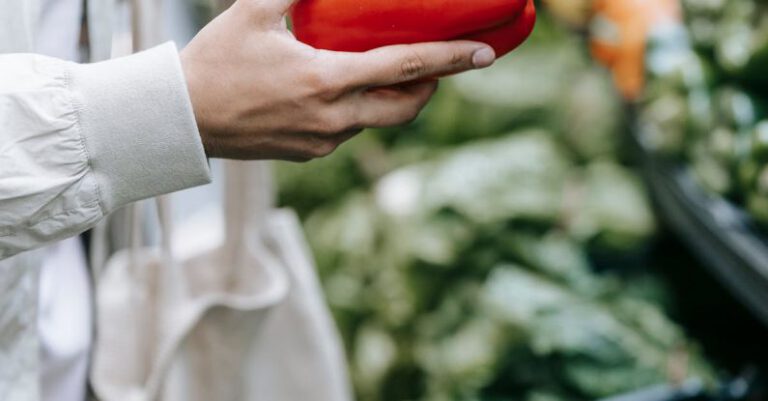 Vegetarian Options - Unrecognizable customer choosing vegetables in supermarket